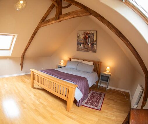 Vaulted bedroom. Charming beams.